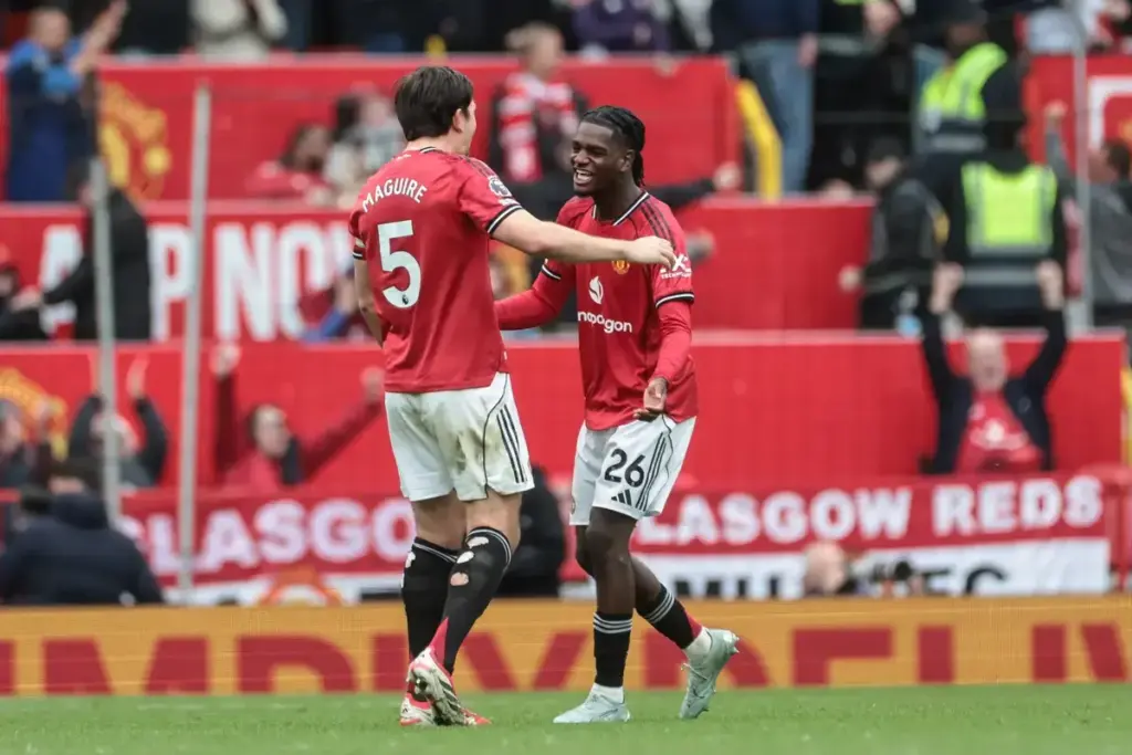 Ayden Heaven playing alongside Harry Maguire for Manchester United